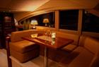 Private yacht cruise in the Bergen area, inside the salon after dark