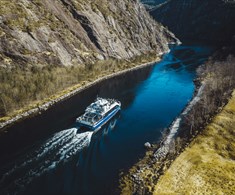 The fjord cruise passes through the narrow Mostraumen