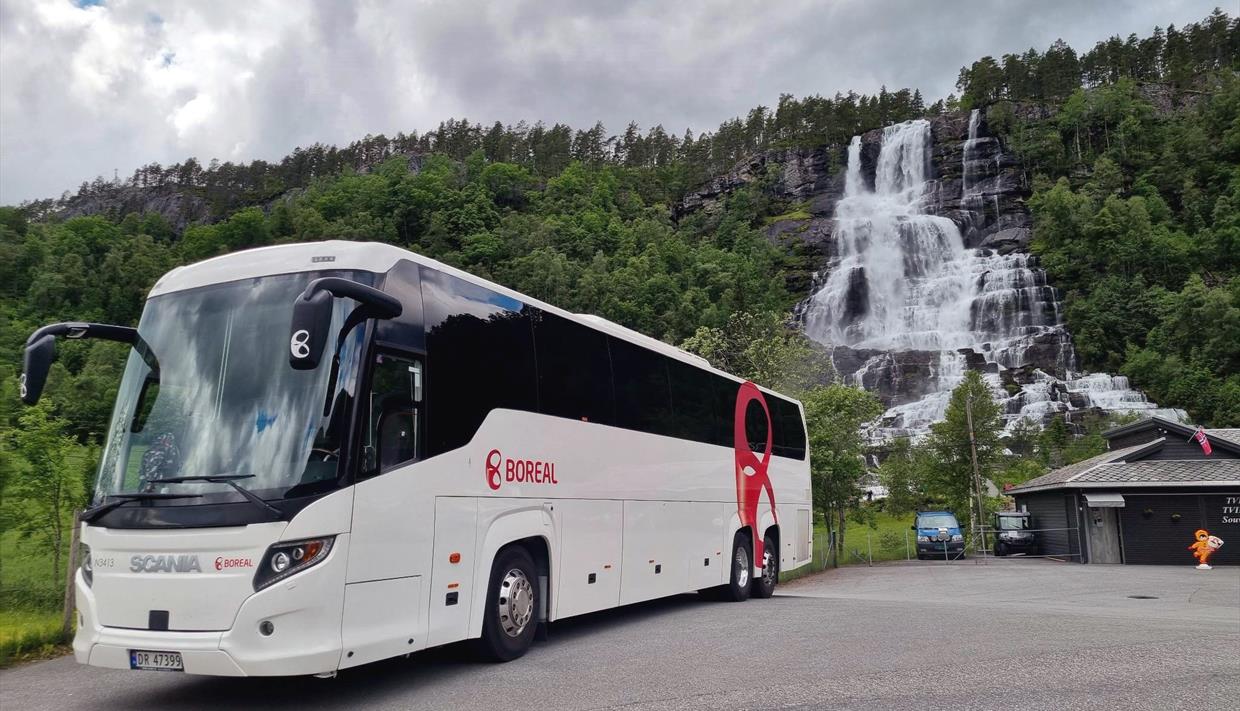Boreal Travel by Tvindefossen Waterfall