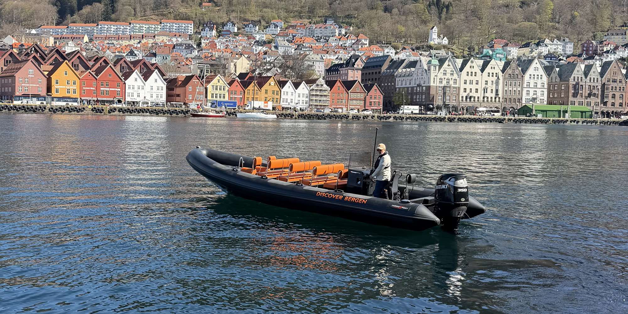 Rib boat with Bryggen in Bergen in the background