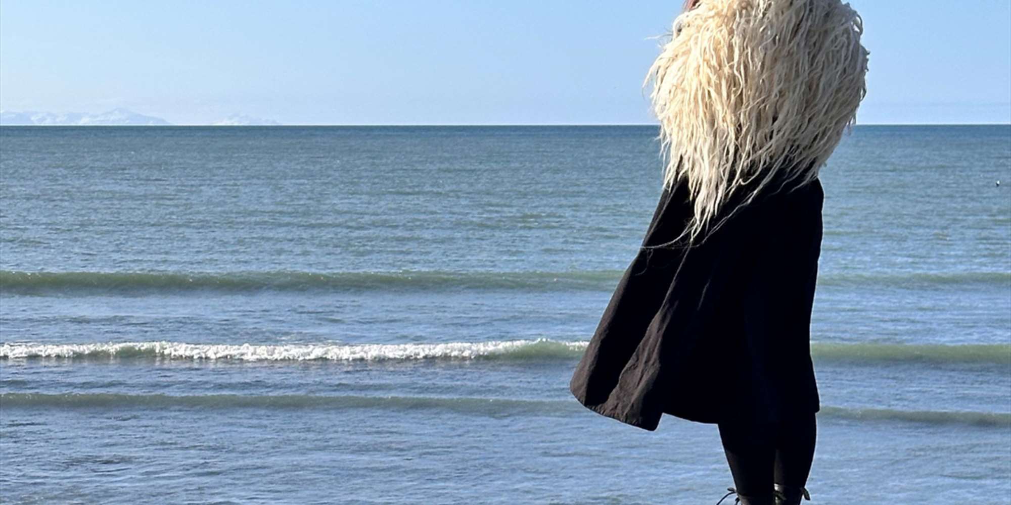 Dressed in a varafell, looking over the sea