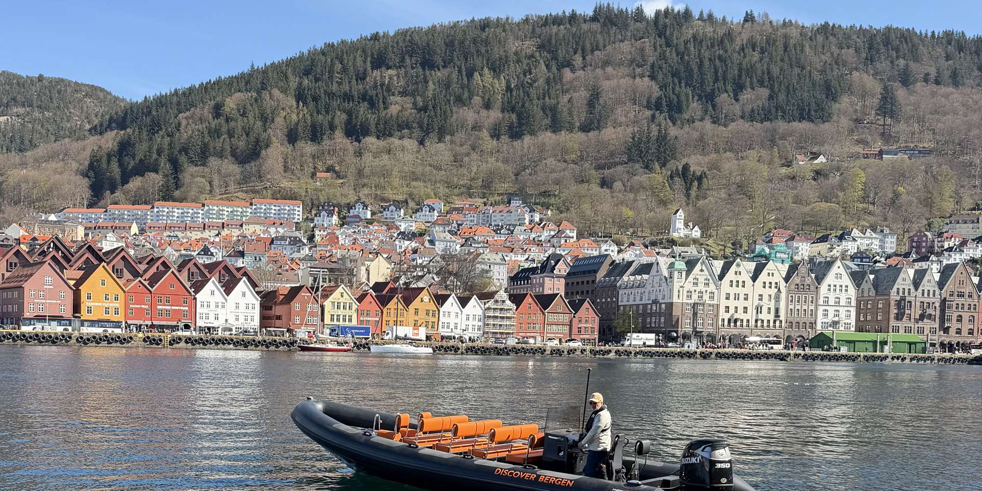 Rib boat with Bryggen in Bergen in the background