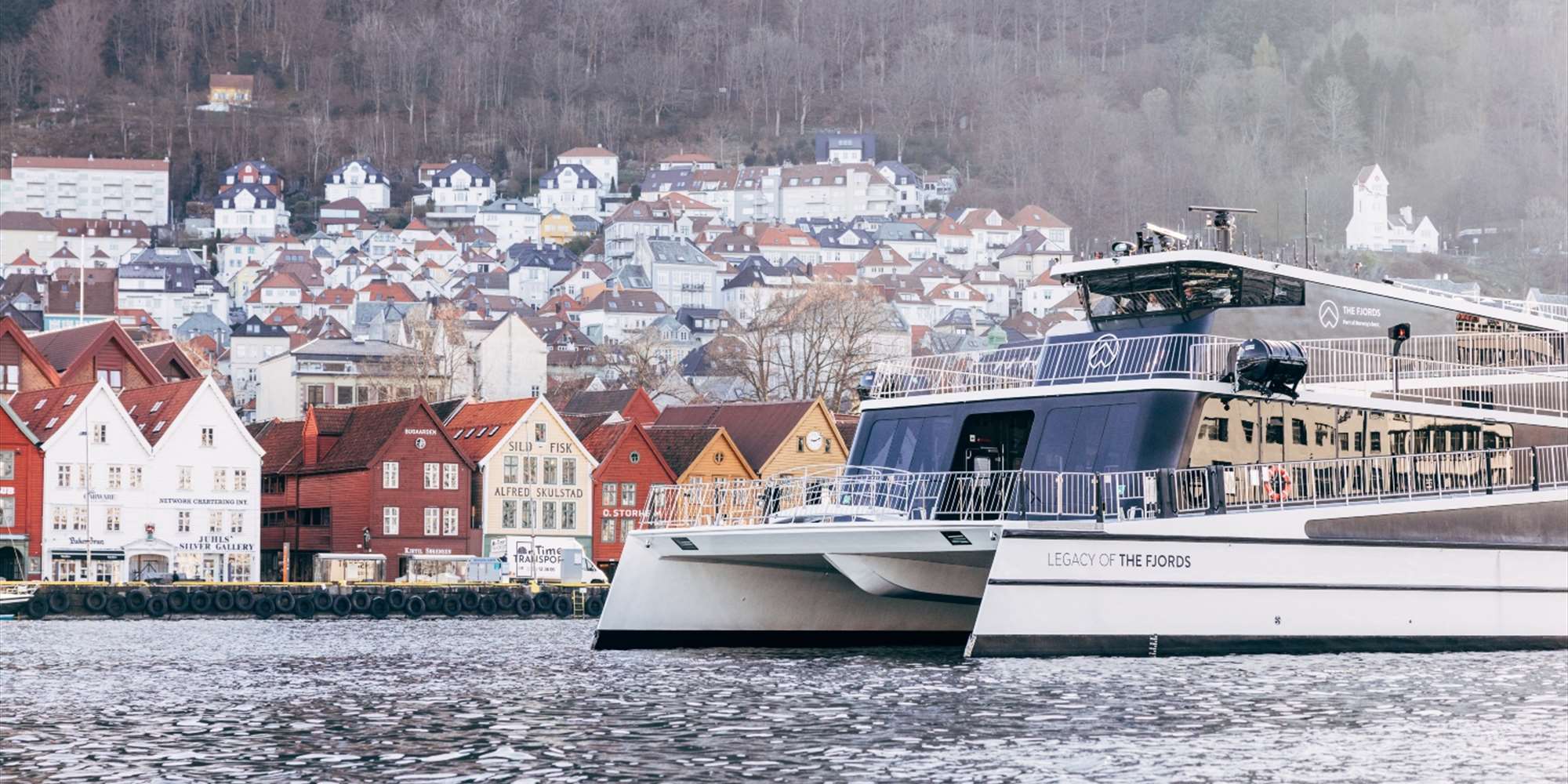 Bergen City Cruise passing in front of Bryggen