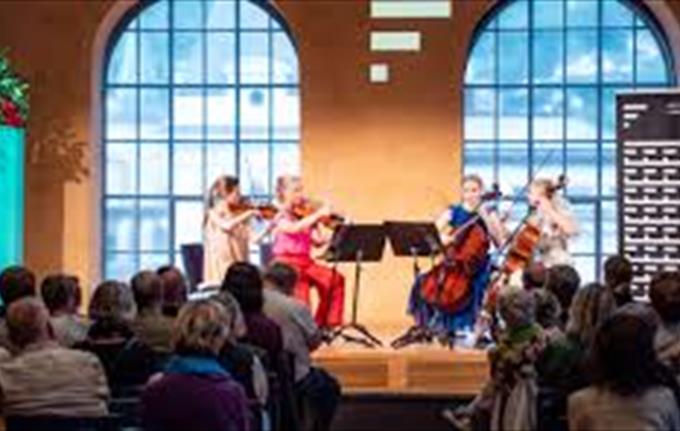 Amalie Stalheim with young string players