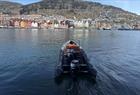 Rib boat with Bryggen in Bergen in the background