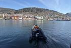 Rib boat with Bryggen in Bergen in the background