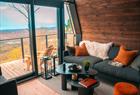 Seating area by the floor-to-sealing window
