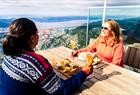 People enjoying a meal at Mount Ulriken