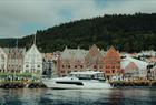 Sailing past the colorful Bryggen harbor in Bergen