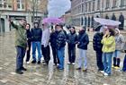 Young visitors listen to the strange tales of Bergen. Vågsallmenningen