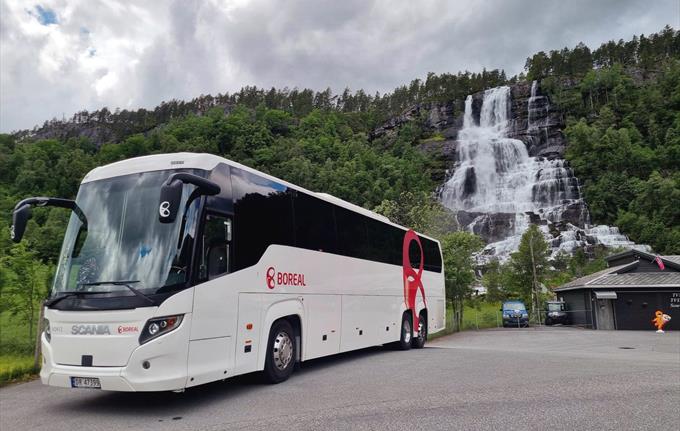 Boreal Travel by Tvindefossen Waterfall